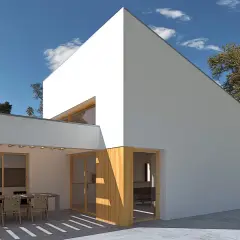 Casa moderna con patio y mesa. La orientación noreste aprovecha el sol de la mañana para iluminar el espacio.