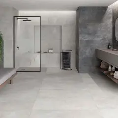 Baño moderno con ducha, lavabo doble y banco. La diferencia entre baldosa y azulejo se aprecia en los acabados de pared y suelo.