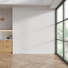 Cocina moderna con armarios de madera clara y un suelo de espiga perfecto para limpiar el suelo de madera.