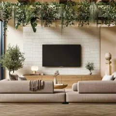 Salones modernos con paredes texturizadas y exuberante vegetación colgante. Sofás cómodos y una gran ventana que da a un jardín.