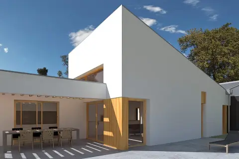 Casa moderna con patio y mesa. La orientación noreste aprovecha el sol de la mañana para iluminar el espacio.