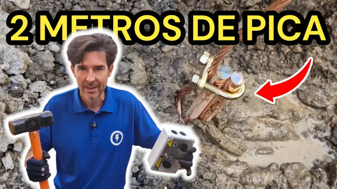Instalación de puesta a tierra vivienda unifamiliar. Hombre con martillo y caja de conexión, mostrando la pica de tierra.