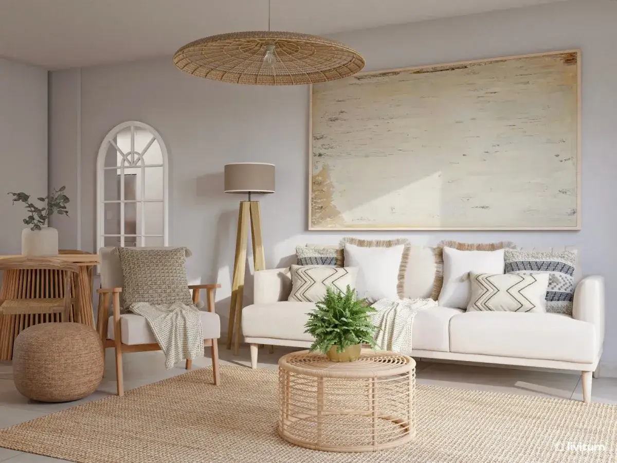 Sal&oacute;n acogedor con sof&aacute; blanco, mesa de centro de rat&aacute;n y alfombra de yute. Ideal para inspirarse sobre cuanto cobra una dise&ntilde;adora de interiores en Espa&ntilde;a.