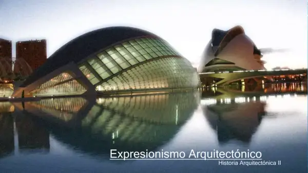 Edificios futuristas reflejados en el agua, un ejemplo de expresionismo arquitectónico.